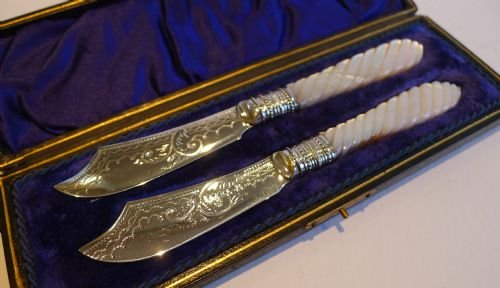 boxed pair antique english silver plate and mother of pearl butter knives c1890