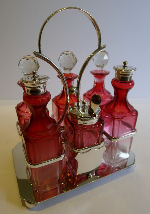 antique english cranberry glass silver plated cruet set by deykin harrison c1900