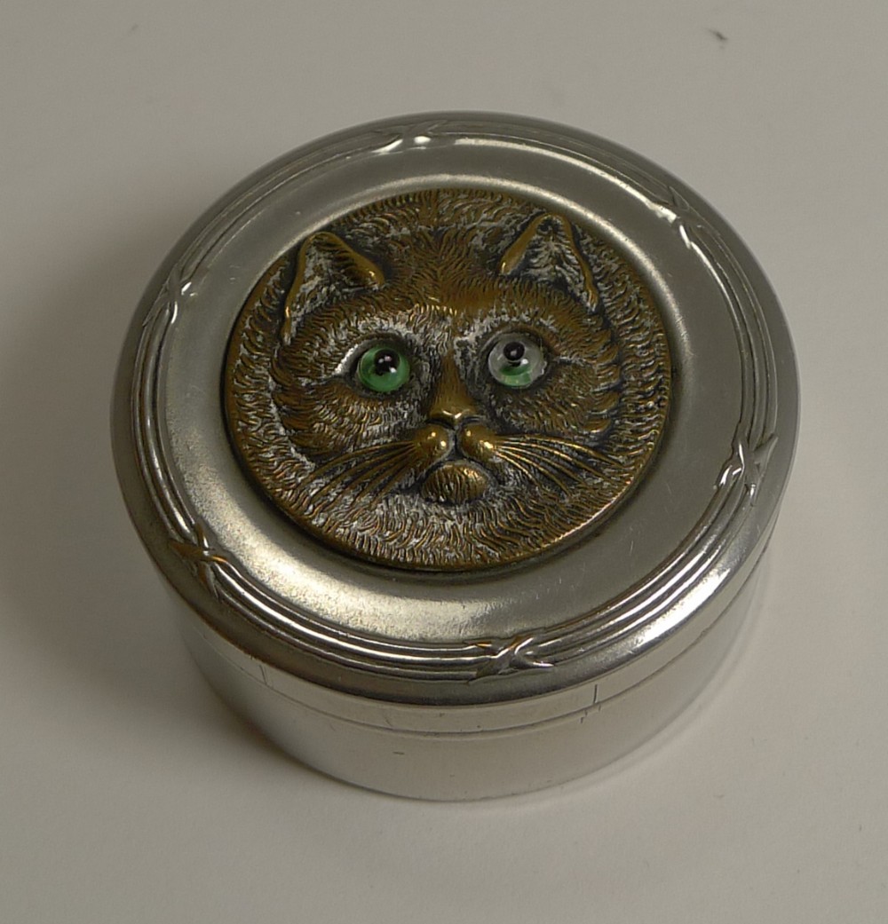 antique nickel box brass cat with glass eyes c1900
