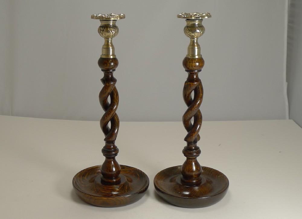 pair antique english oak open barley twist candlesticks brass thistle tops