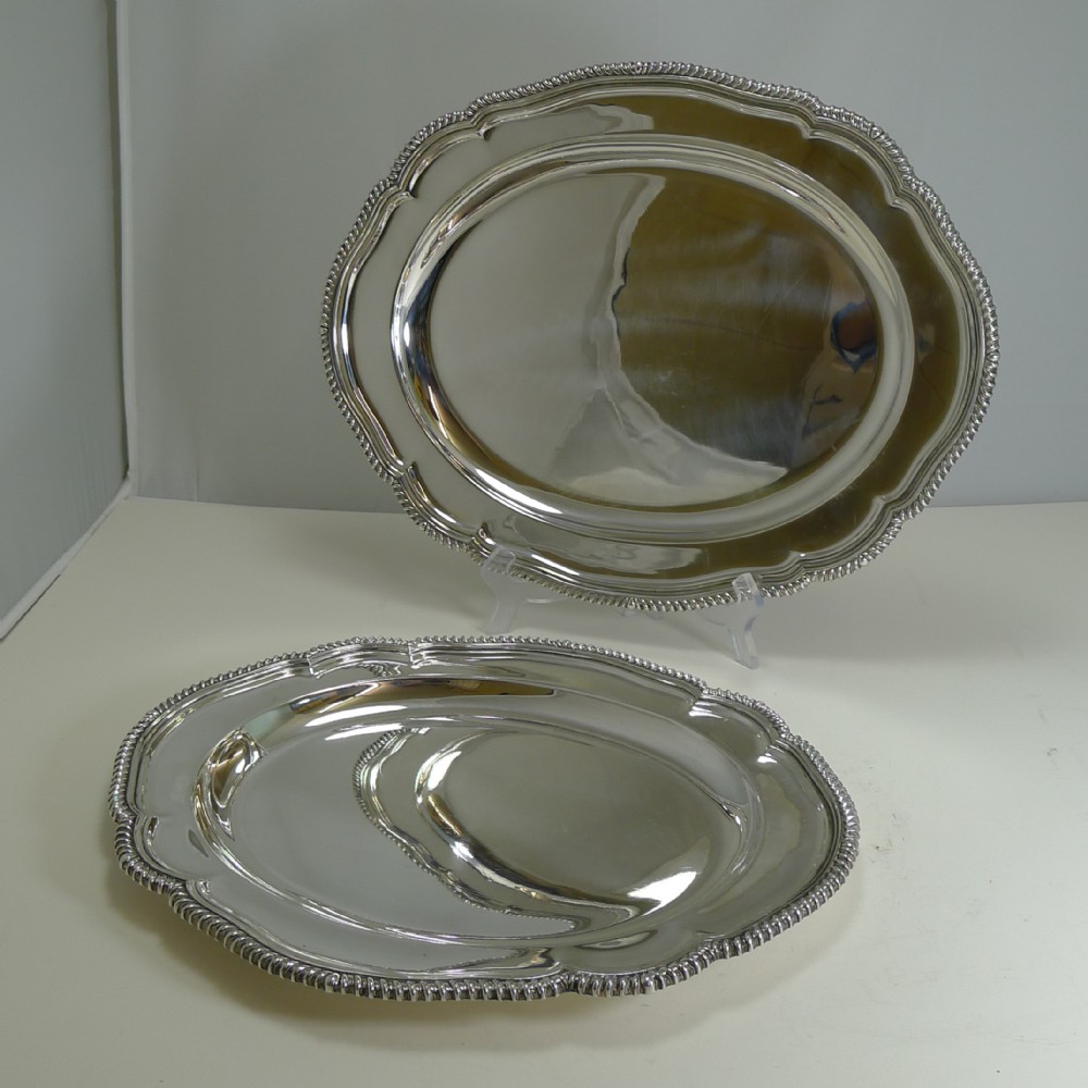 pair graduated antique english silver plated serving platters by elkington