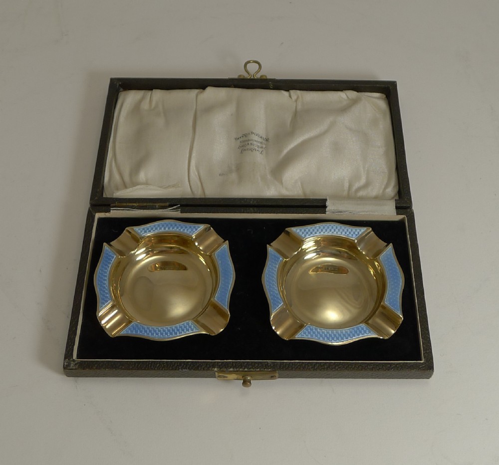 pair cased silver gilt and blue guilloche enamel ashtrays 1929