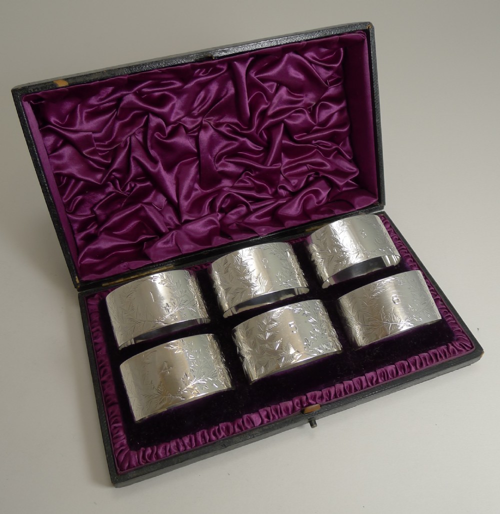 set six cased antique english sterling silver napkin rings ferns