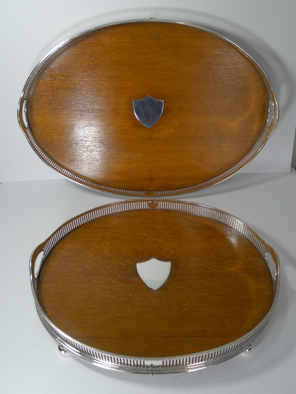 grand graduated pair late victorian oak and silver plate serving trays
