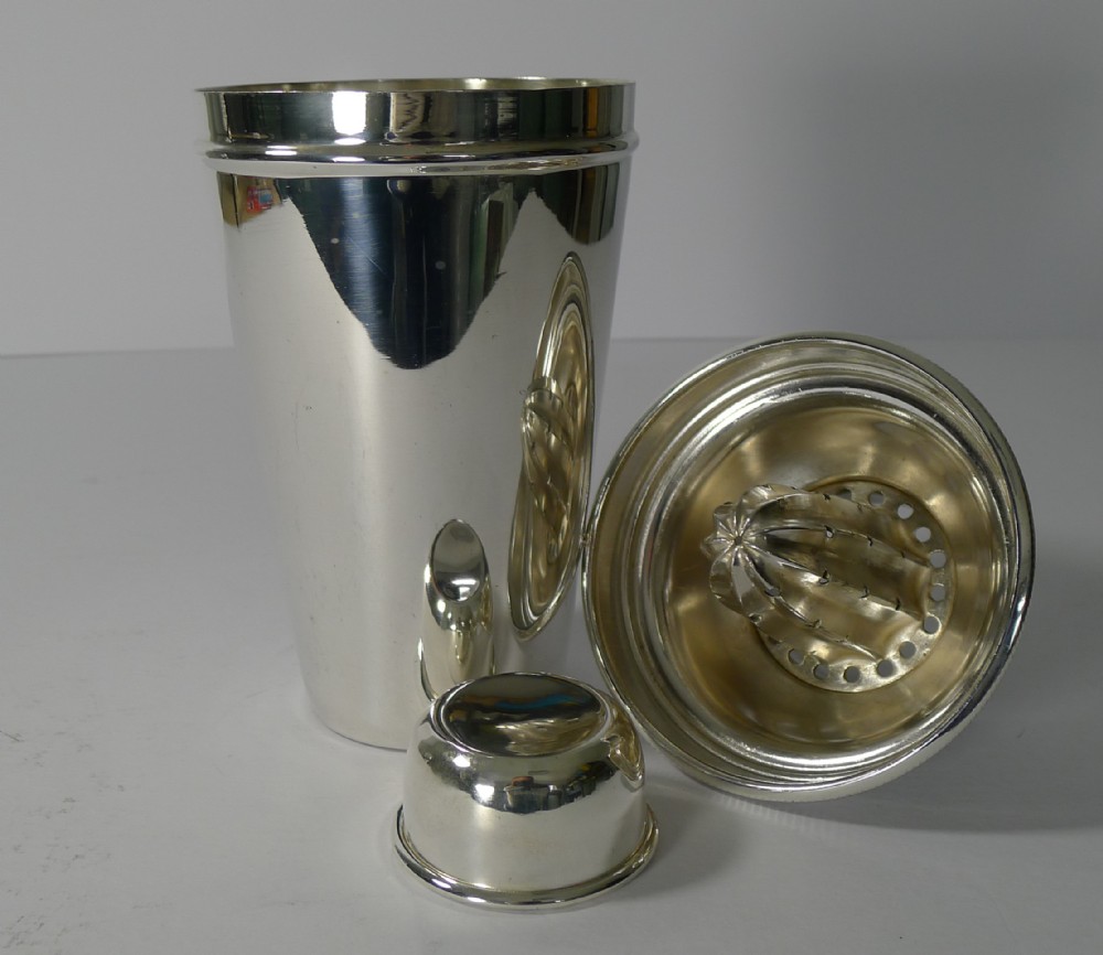 english silver plated cocktail shaker with lemon squeezer by goldsmiths and silversmiths co