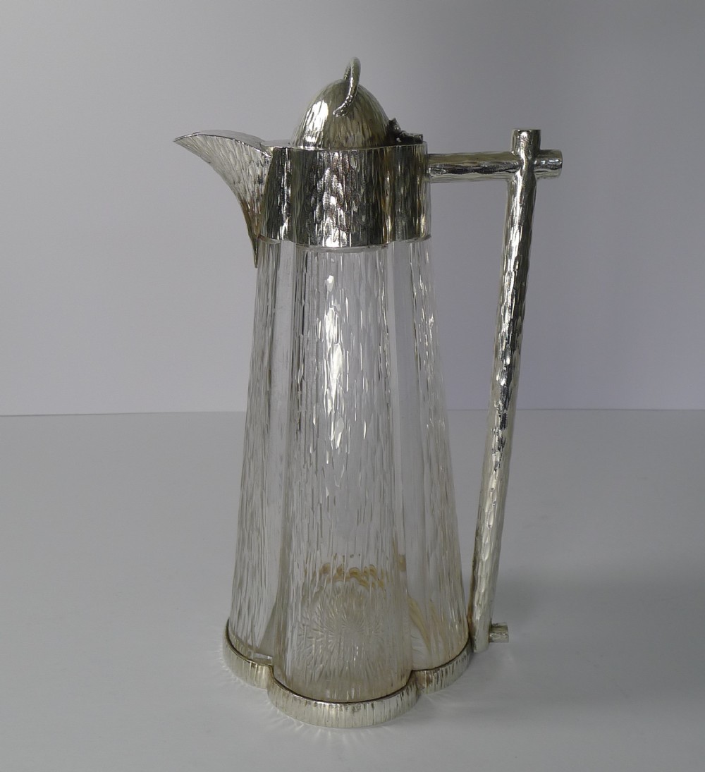 outstanding claret jug in the manner of christopher dresser 1893